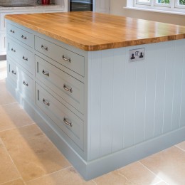large kitchen island with oak worktop